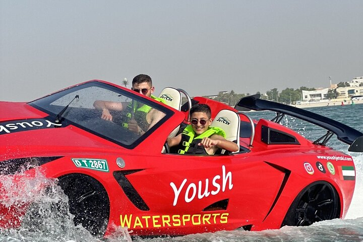 Experience the sleek design of the jetcar as you cruise past iconic landmarks blending luxury with speed all while soaking in the beauty of Dubai's stunning coastline.